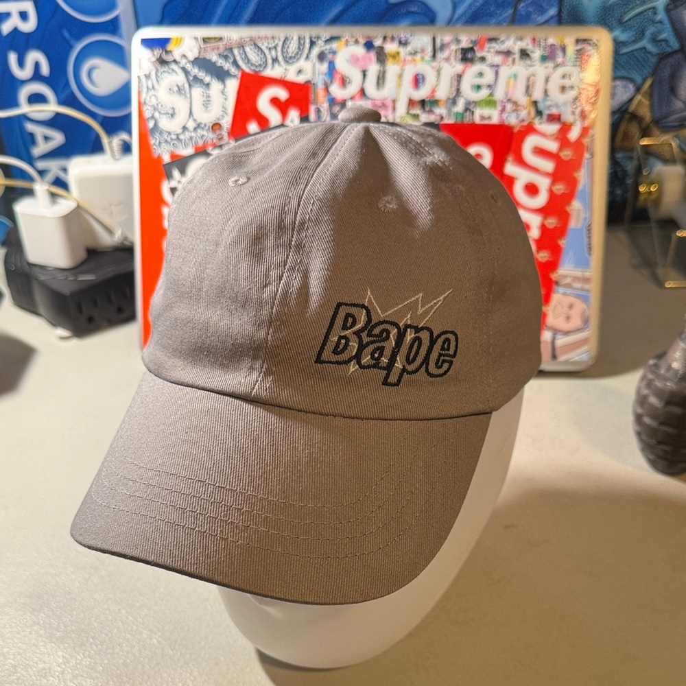 $OLD on Whatnot for $20!*
A Bathing Ape Bapesta Gray Logo Cap